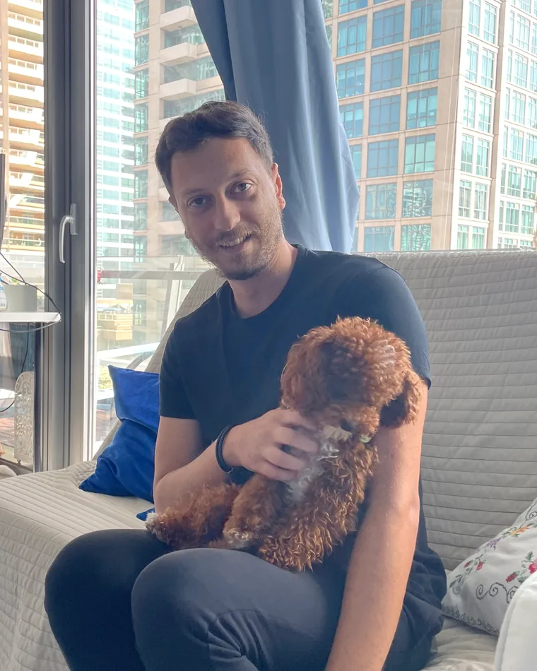 Christos with a poodle at home